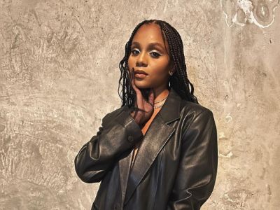 Geffri Hightower is wearing a black leather jacket as she is posing for the picture.